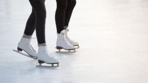 Photo of two pairs of ice skates enjoying Vail ice skating