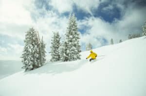 Picture of a person riding the Vail back bowls on a sunny winter day