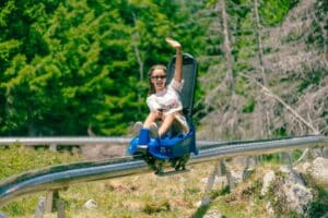 Kids riding down mountain coaster at Epic Discovery in Vail