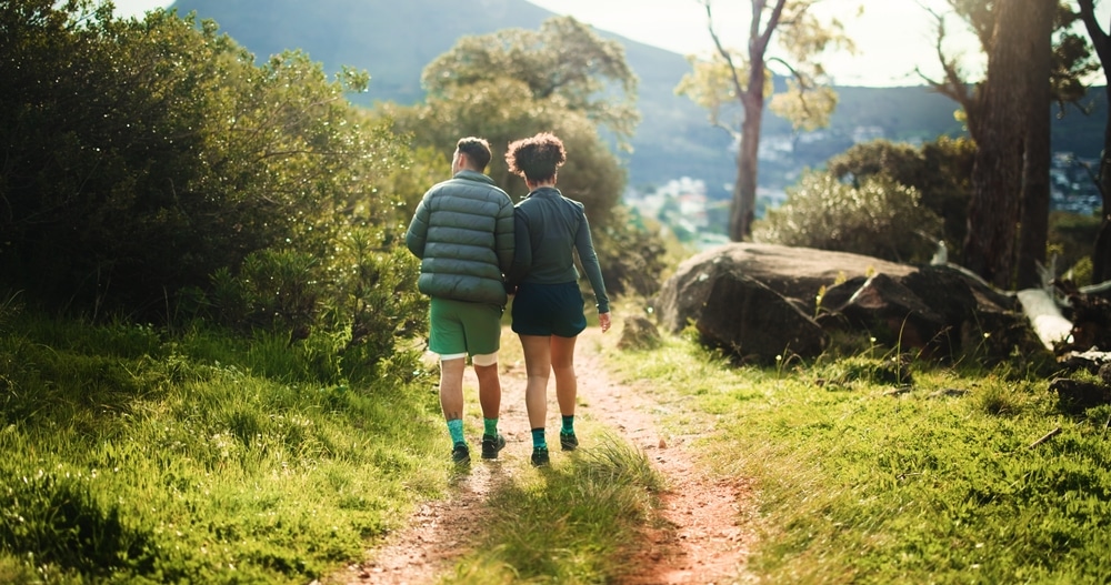 couple walking on nature path in Eagle Vail